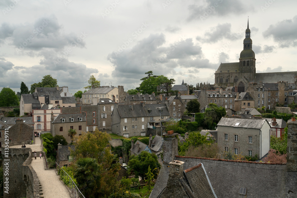 Obraz premium View of the downtown and the Basilica of Saint-Sauveur from the observation deck on the city wall on a summer day, Dinan, Cotes-d'Armor, Brittany, France