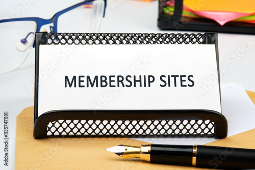 Business concept. Text of MEMBERSHIP SITES close-up, front view on a business card in a stand photo