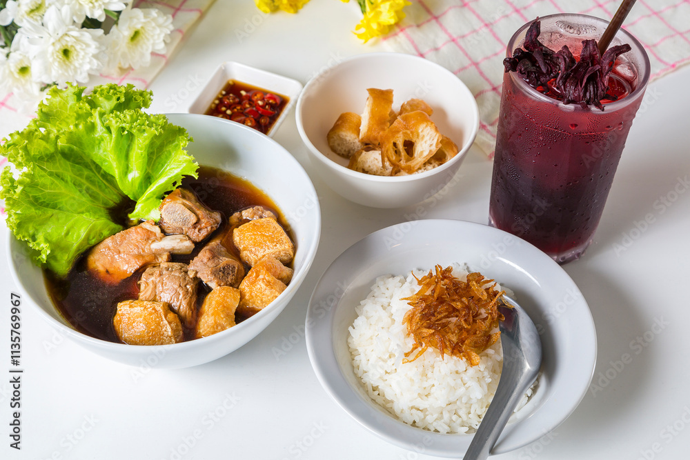 Fototapeta premium Meal set of braised pork soup with rice and roselle juice on the wood table#7