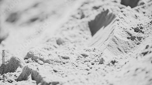 Textured white sand with gentle ridges and smooth grains under soft lighting