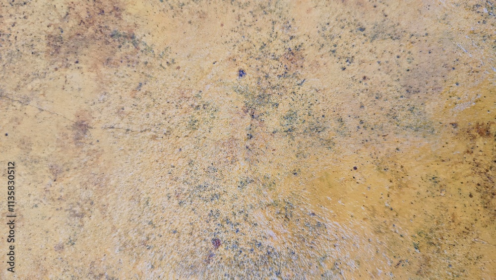 Old yellow cement background wet with water. rust orange concrete texture water effect background Old yellow cement background wet with water. rust orange concrete texture water effect background