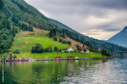 Obraz na płótnie Saebø is a village in Ørsta Municipality, Møre og Romsdal, Norway. The village is located along the Hjørundfjorden, at the eastern end of the Bondalen valley,. w salonie