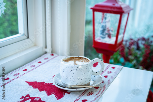 Obraz na płótnie Close up of Hot coffee latte with latte art milk foam in cup mug with Xmas decors and Xmas tree baubles on wood desk Celebrating Merry Christmas and New year,Merry x-mas w salonie