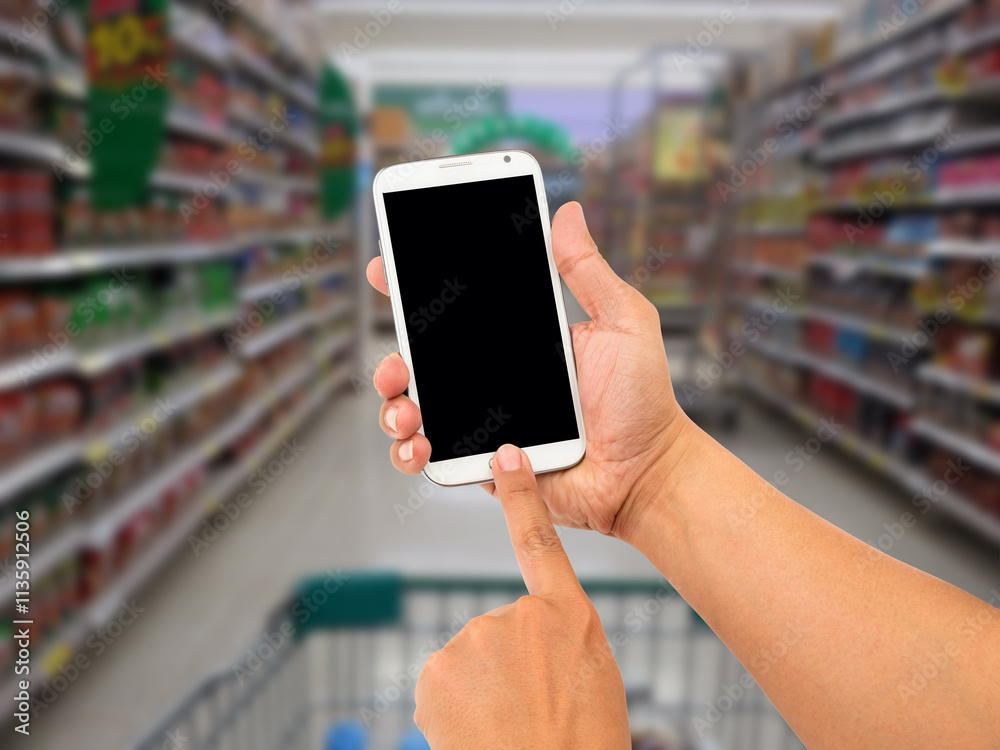 Man hand hold and touch screen smart phone, shopping center or super market background. Man hand hold and touch screen smart phone, shopping center or super market background.