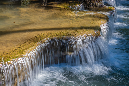 Huay Mae Khamin Waterfall in the rainforest in Si Nakharin National Park, north of Kanchanaburi, Thailand photo