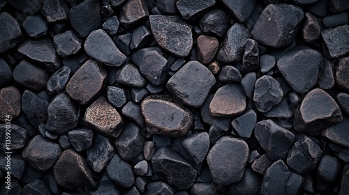 Top view of dark pebbles and stones	