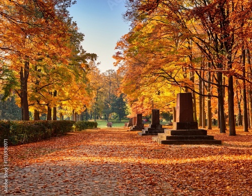 Generated image  Cytadela Park in Poznan in autumn, with golden leaves carpeting the pathways photo