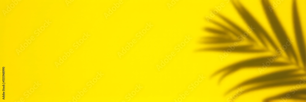 Fototapeta premium A coconut leaf casts a vibrant shadow on a bright yellow background evoking tropical summer holiday feels and aesthetic concepts._00001_