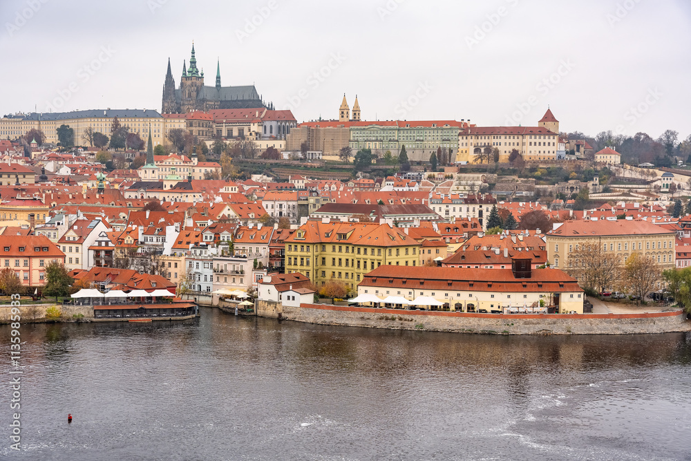 Fototapeta premium Aerial view of the Vltava River with monumental buildings of the unesco city of Prague, Czechia.