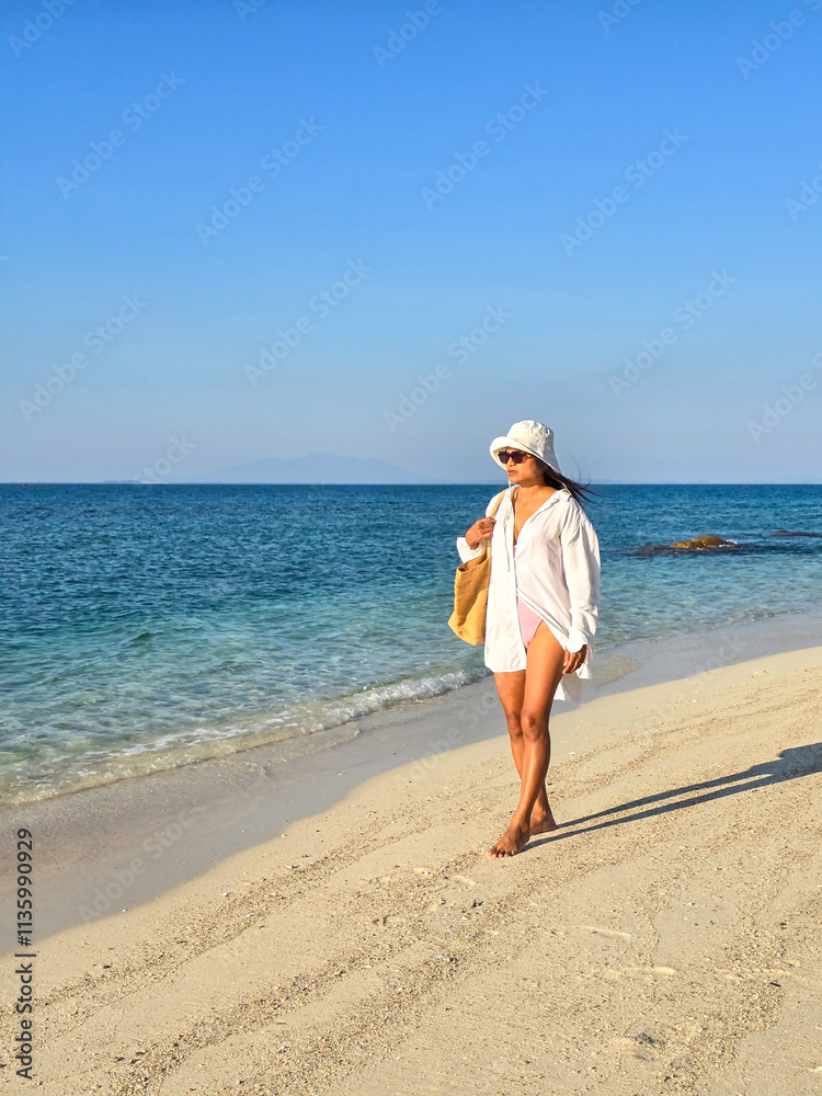 Strolling along the serene shores of Koh Munnork Island in Rayong, Thailand Strolling along the serene shores of Koh Munnork Island in Rayong, Thailand