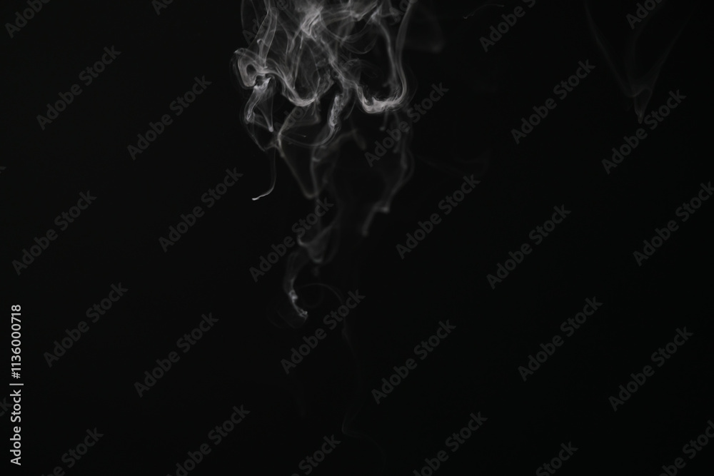 closeup abstract stream of vapor over black background closeup abstract stream of vapor over black background