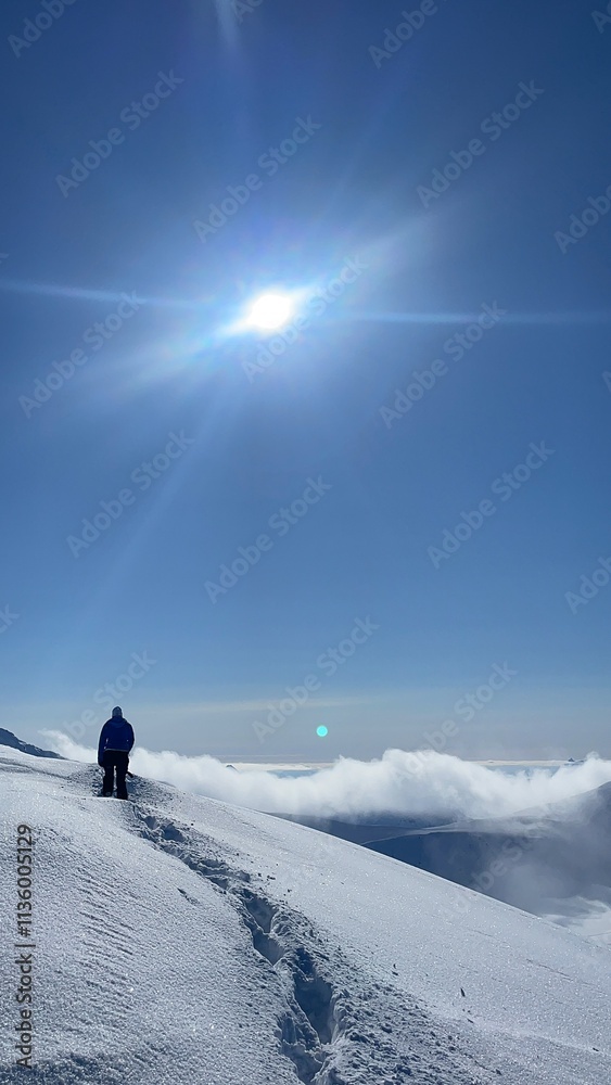 skiing in the mountains above the clouds skiing in the mountains above the clouds