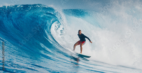 Canvas Print Pro surfer rides big wave in the Maldives