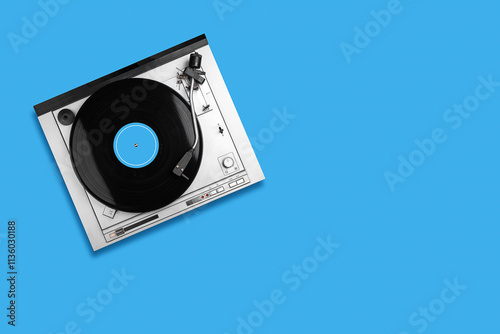 Vinyl Record player, blue background. Top view. Copy space. Musical