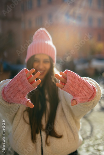 A Fashionable Young Woman Sporting a Cozy Winter Outfit While Enjoying the Outdoors