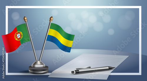 Portugal and Gabon National flags on small table with bokeh background, cooperative relationship