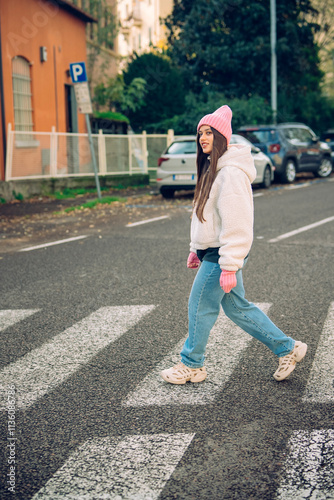 A Young Woman Elegantly Crossing the Street in a Lively Urban Setting, Full of Life