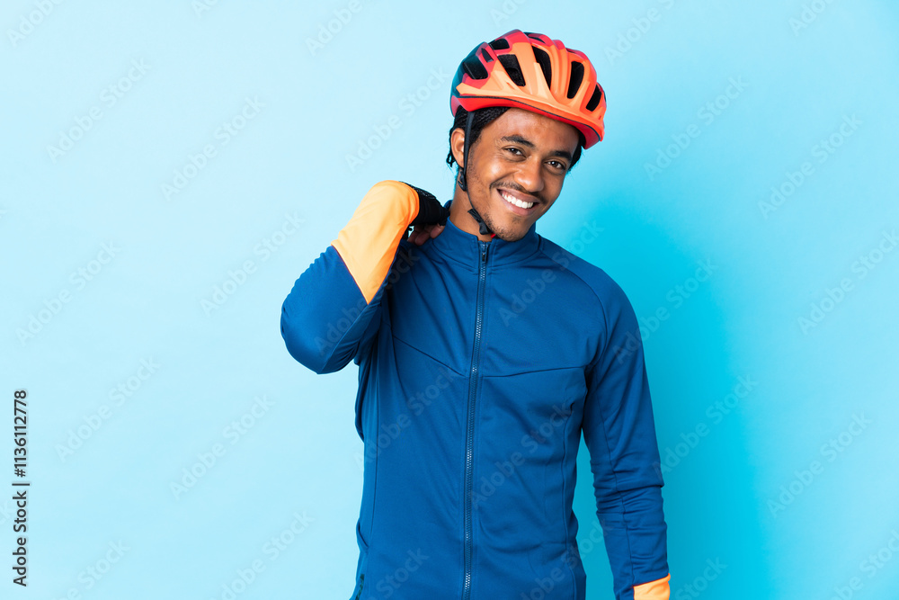 Young cyclist man with braids over isolated background laughing Young cyclist man with braids over isolated background laughing