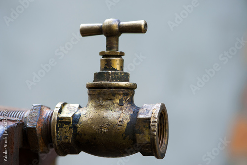old brass water tap, Vintage. tap valve. old copper retro faucet on a rusty pipe. plumbing, repair, dismantling. close-up. isolated