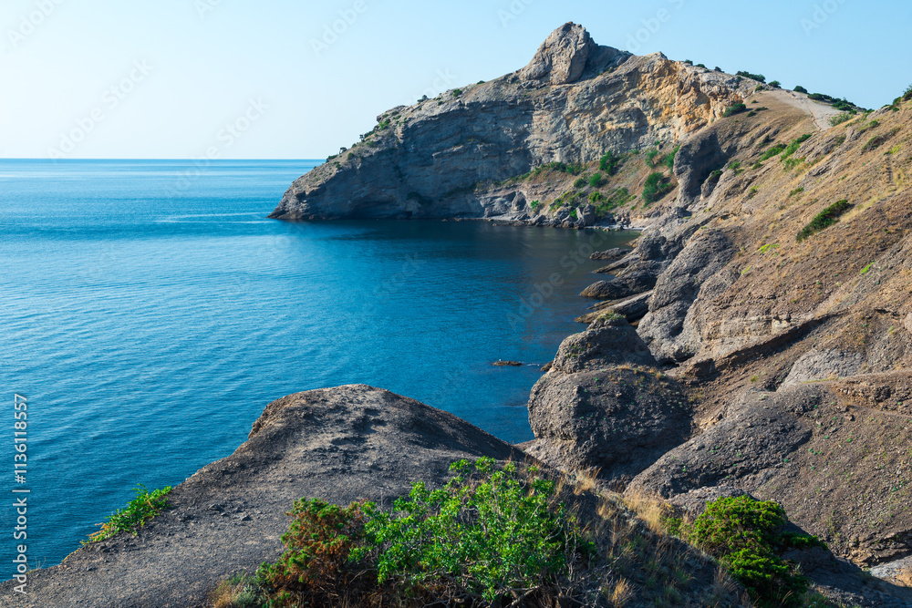 Picturesque seascape with beautiful view of Cape Kapchik and the Black Sea. Crimean Peninsula. Russia Picturesque seascape with beautiful view of Cape Kapchik and the Black Sea. Crimean Peninsula. Russia