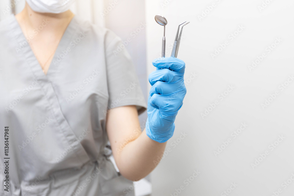 hand of a dentist in gloves with instruments hand of a dentist in gloves with instruments