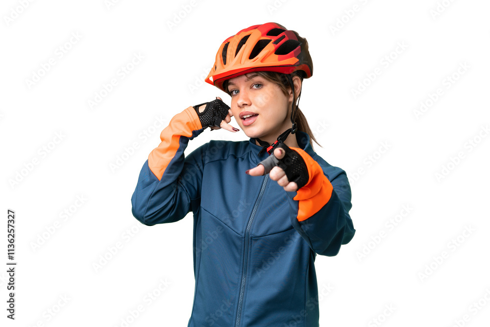 Young cyclist girl over isolated chroma key background making phone gesture and pointing front Young cyclist girl over isolated chroma key background making phone gesture and pointing front