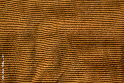 Detailed bright brown jeans fabric background texture.
