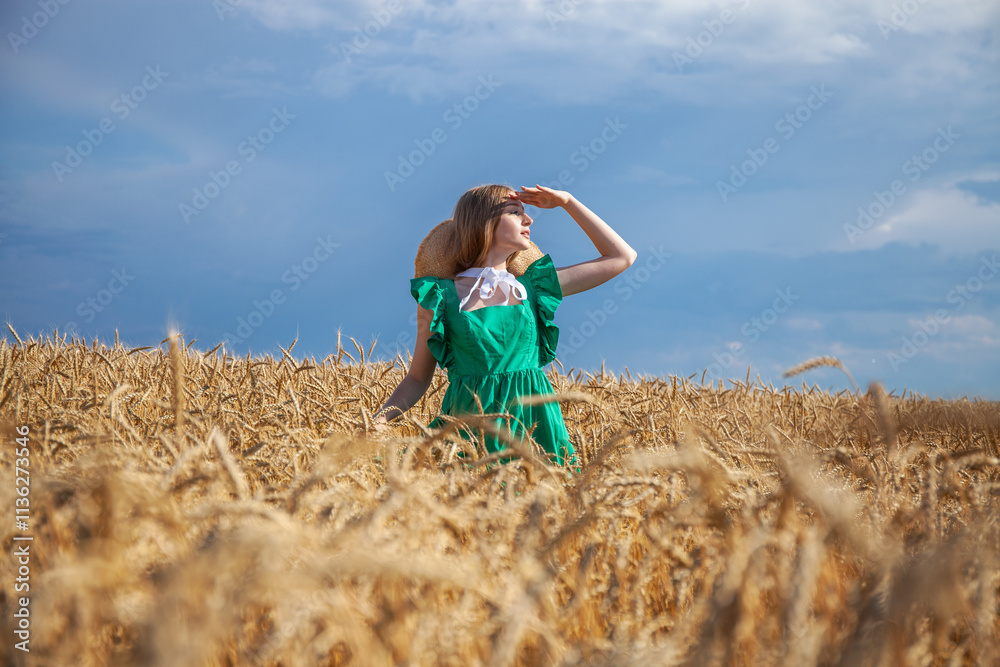 Young beautiful blonde girl posing in a wheat field Young beautiful blonde girl posing in a wheat field