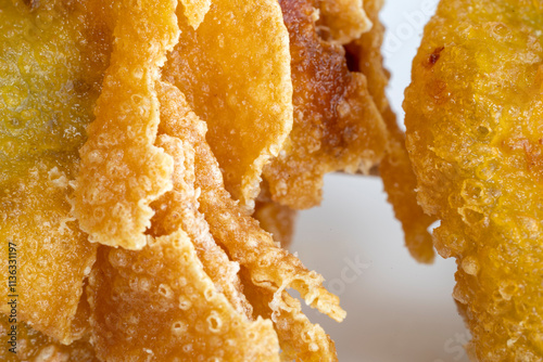 CLose-up view of chine food wanton fried ina white color plate with stick on it