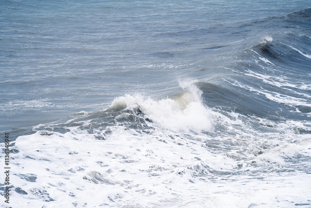Seascape of a stormy foam wave with shades of blue in Black Sea. Nature background wallpapers. Landscape of light blue raging sea.