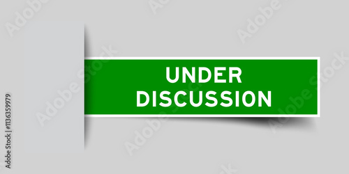 Green color square label sticker with word under discussion that inserted in gray background