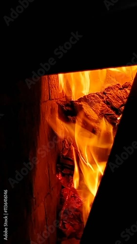 Vertical background in the corner of a burning fireplace