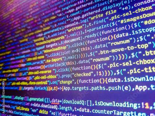Background of program code. Color coding on screen. Computer code background. Abstract digital background featuring vibrant binary code in blue, purple, and orange tones. Web dewelopment.