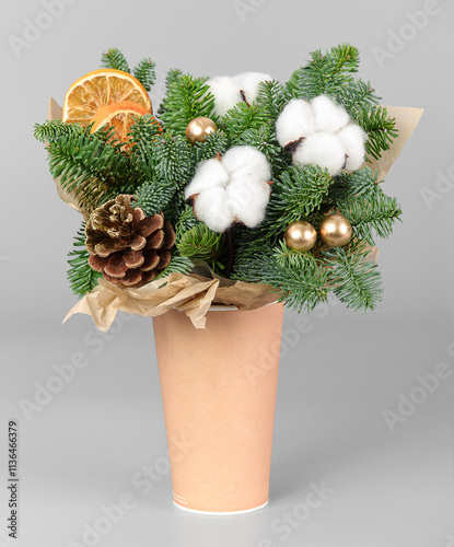 A traditional Christmas floral arrangement of green fir branches and flowers. New Year's decor for the interior