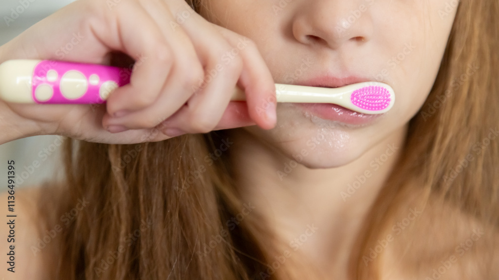 Portrait of child girl cleaning mouth with a toothbrush at bathroom Portrait of child girl cleaning mouth with a toothbrush at bathroom