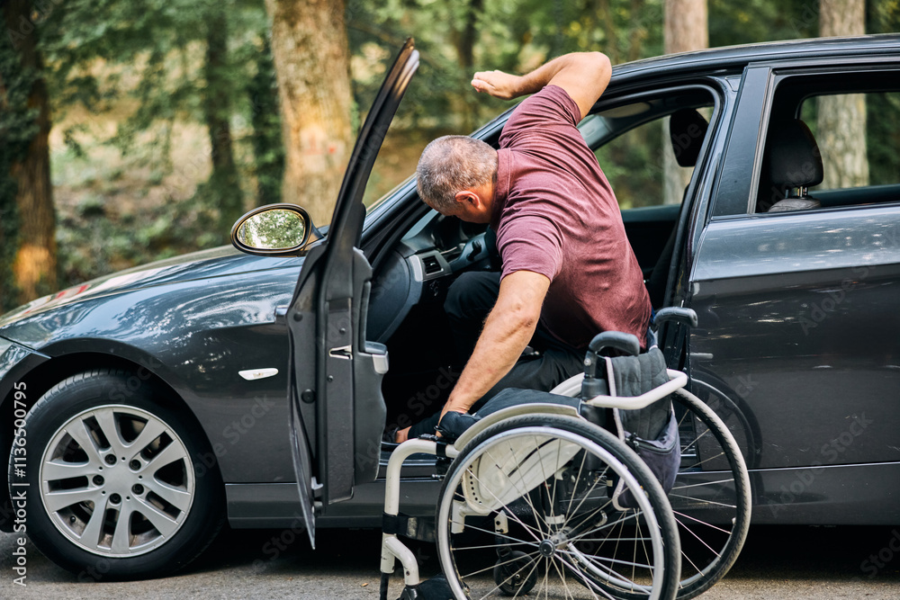 Man In Wheelchair Getting In Car Man In Wheelchair Getting In Car
