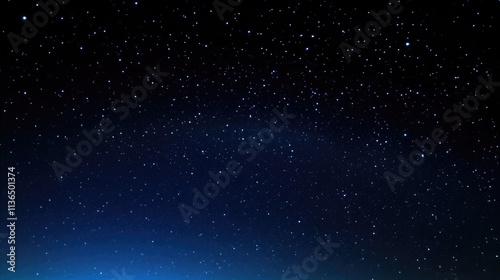 Captivating starry night sky with the Milky Way visible from an angle, dark blue and black background, scattered stars, perfect for night photography, evoking wonder, tranquility,