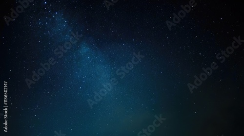 Captivating starry night sky with the Milky Way visible from an angle, dark blue and black background, scattered stars, perfect for night photography, evoking wonder, tranquility