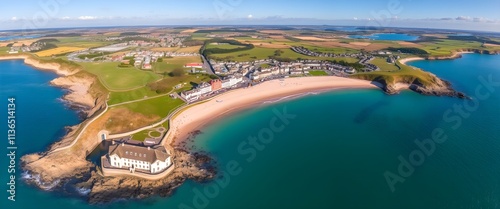 Wallpaper Mural Aerial view of a coastal area featuring sandy beaches, lush green landscapes, and a quaint seaside town nestled along the shore. Torontodigital.ca