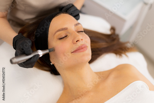Revitalizing skin treatment with microneedling and mesotherapy technique in a serene spa environment