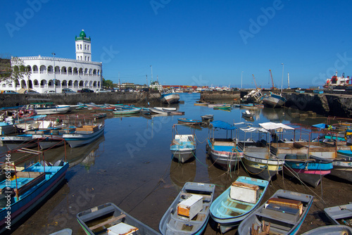 Grand Mosque in Moroni with boats in the foreground photo