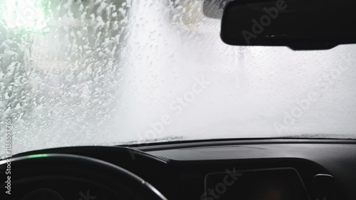 View of the automatic car wash from inside the car during washing