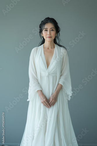 portrait of Asian bride in lond simple white  wedding dress photo