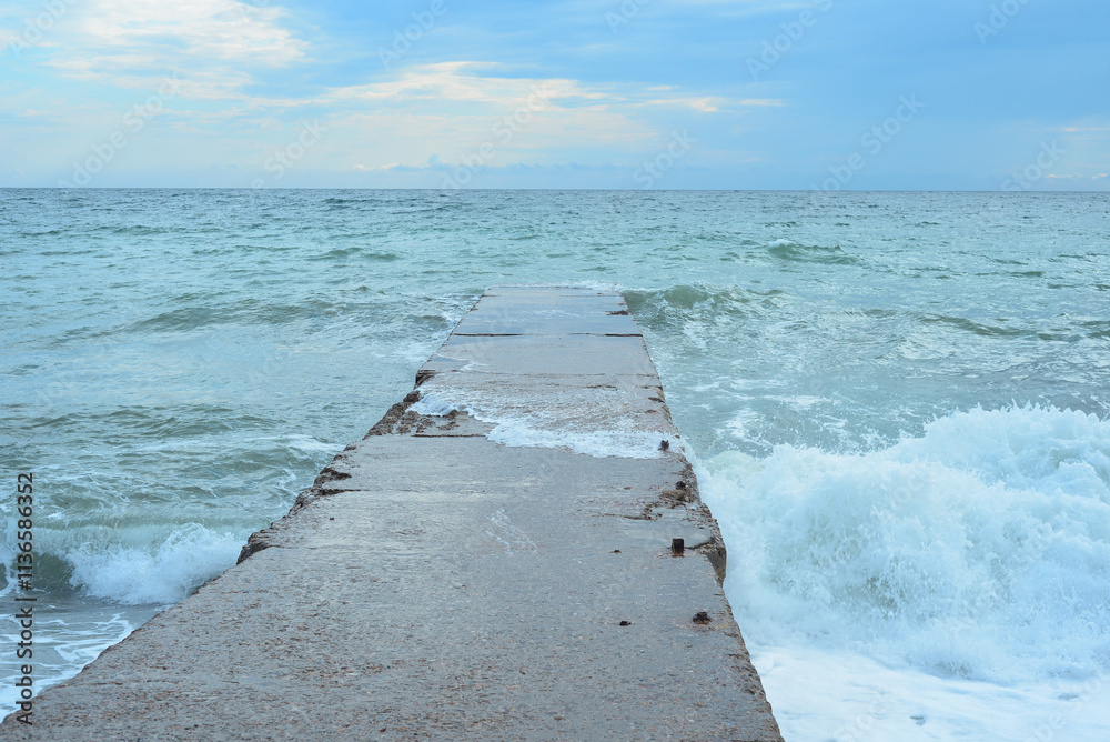Background landscape view of Sudak Bay, the city of Sudak and its embankment in Crimea