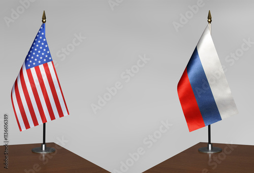 Table flags of USA and Russia on a gray blurred background