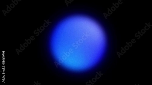 Abstract blurred grainy blue gradient glowing orb shape looped on black background