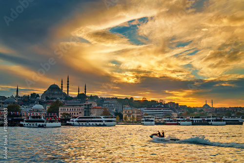 sunset in Istanbul cityscape, view of Golden Horn Bay, city architecture, ships at pier, mosques and city square photo