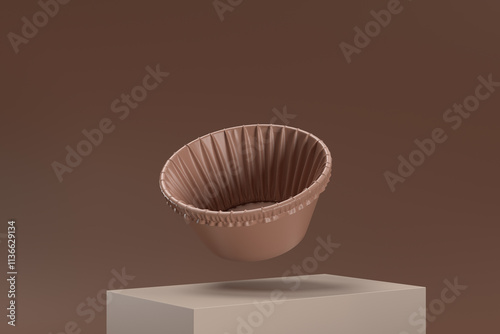 A brown paper cupcake is floating in the air