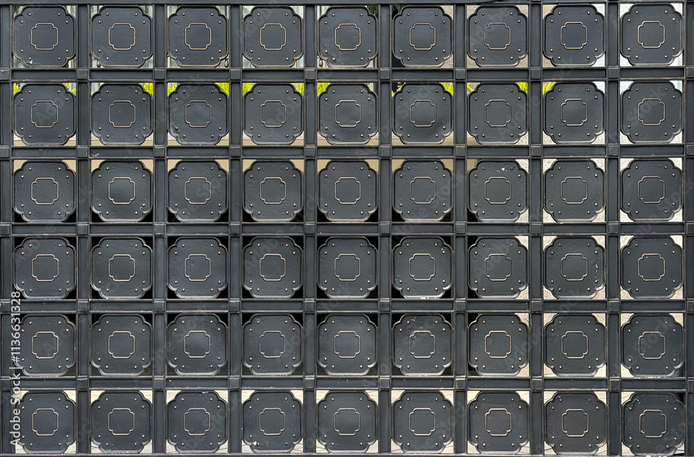Wrought iron shaped in grid columns and hexagon plate painted in matt black. Hexagonal shape repeated pattern of wrought iron for fence or front gate door. Seamless background texture Wrought iron shaped in grid columns and hexagon plate painted in matt black. Hexagonal shape repeated pattern of wrought iron for fence or front gate door. Seamless background texture