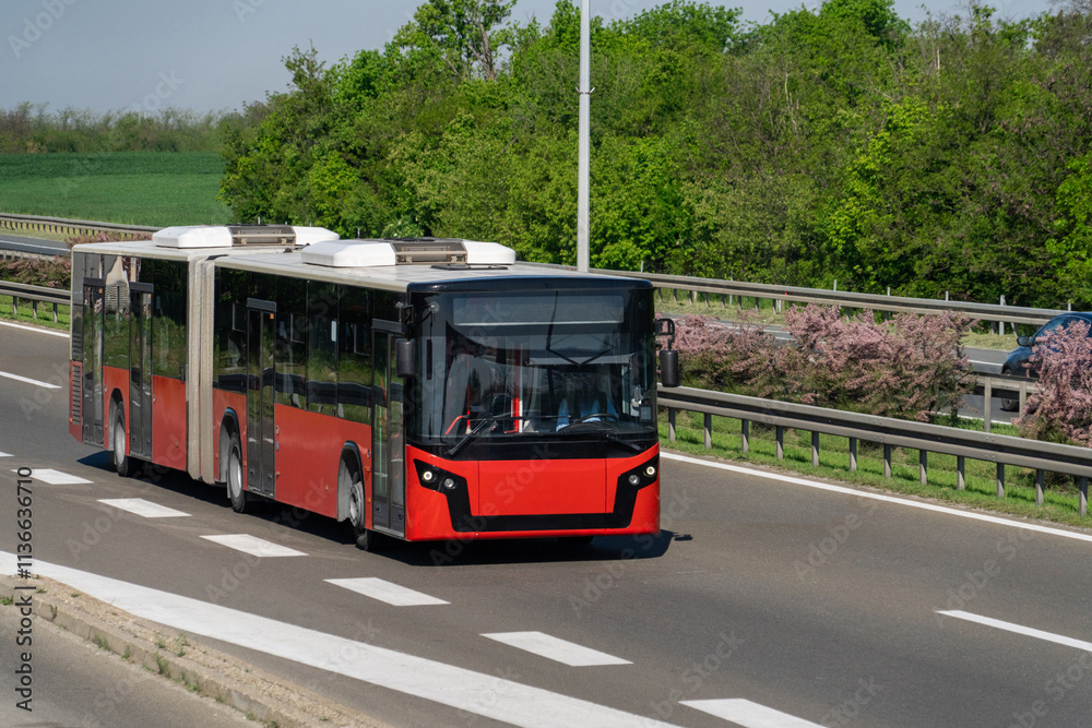 Fototapeta premium Red city bus on the highway